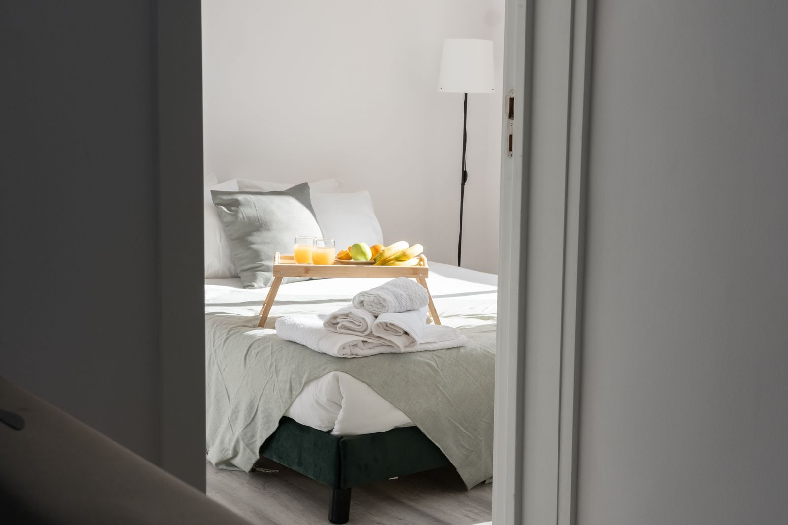A sunlit bed and breakfast tray
