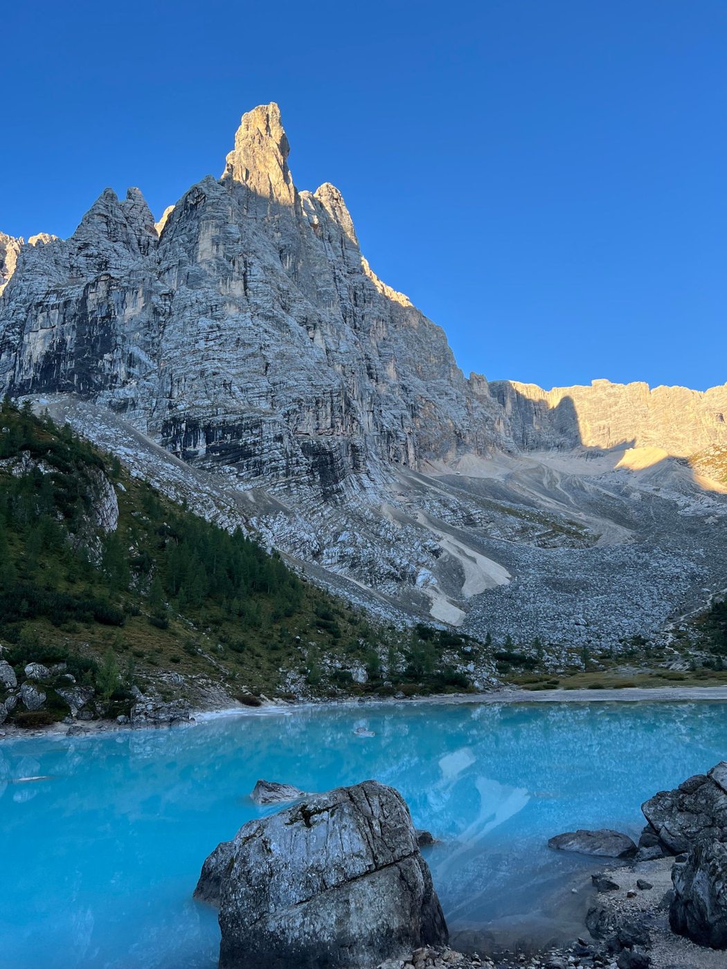 Turquoise water and rocky walls in the Dolomites